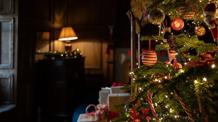 Panelled bedroom at Nunnington Hall with Christmas tree